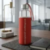 Eco-Friendly Glass Water Bottle with Protective Red Neoprene Sleeve & Carrying Strap – 500ml